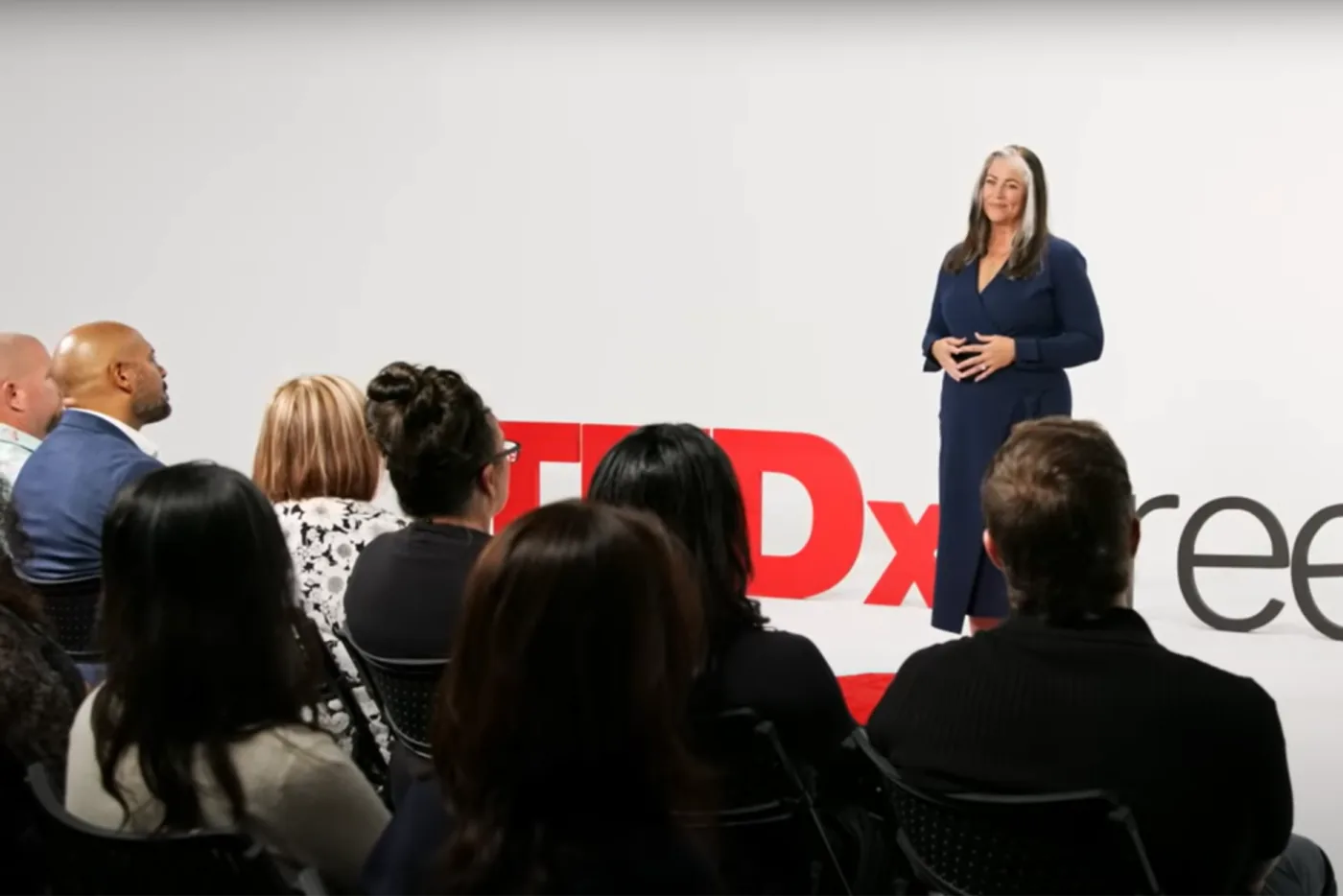 Teresa Lodato giving her TEDx talk to an audience